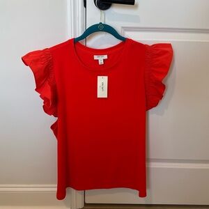 New with tag! Beautiful orange top with tag